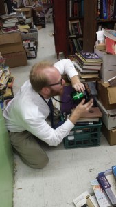 David McCarty, sizing up the photograph of Fred Smith at Choctaw Books